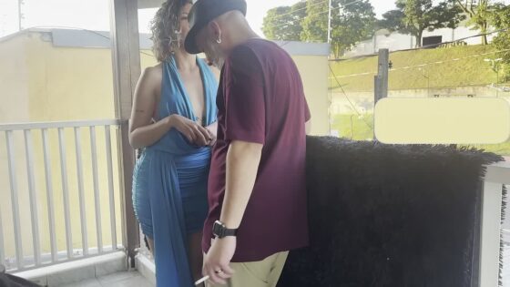 Strangers making out on a balcony during the party.